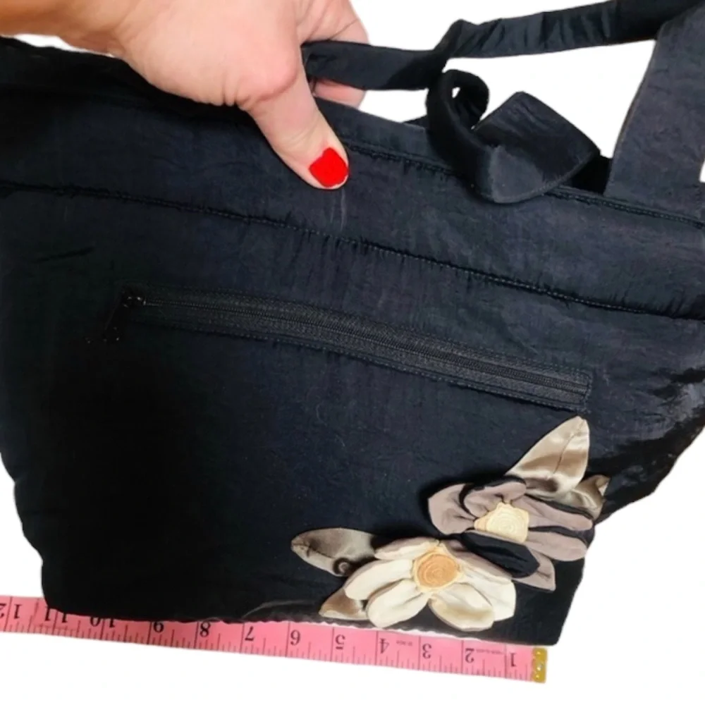 Arisha black super cute microfiber like fabric bag w/ attached flower detail